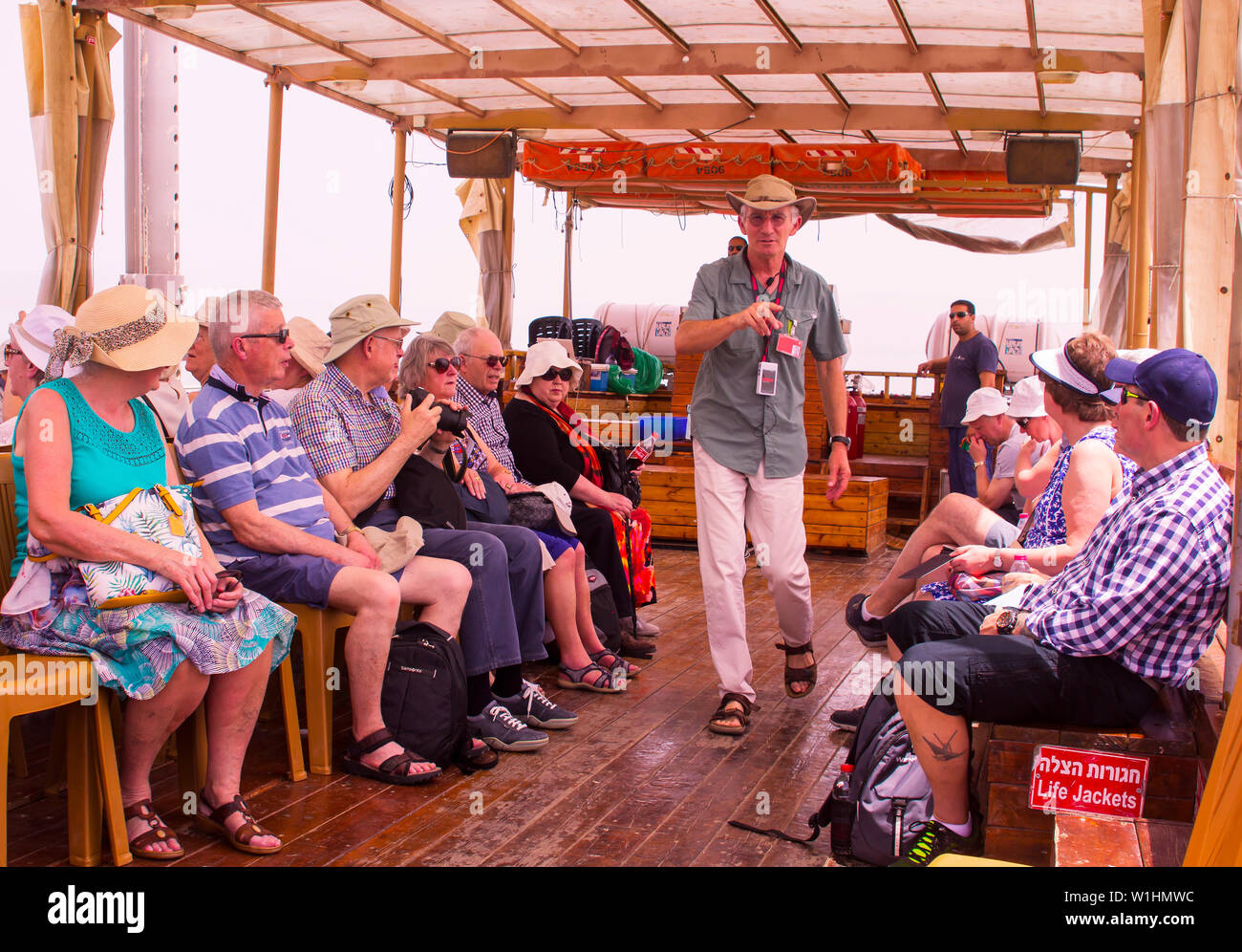 3 June 2019 A tourist guide counts heads of a small group of tourists takeing a boat trip on the Sea of Galilee near Tiberias in Israel Stock Photo