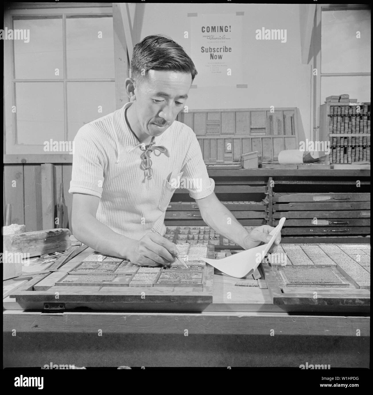 Poston, Arizona. Saburo Tomita, foreman of the print shop, and the only Japanese-American to hold a . . .; Scope and content:  The full caption for this photograph reads: Poston, Arizona. Saburo Tomita, foreman of the print shop, and the only Japanese-American to hold a card in the Pressman's Union. Saburo formerly worked for the Morrisey Brothers Printing Company in Los Angeles, and has had 22 years experience as a pressman. Stock Photo
