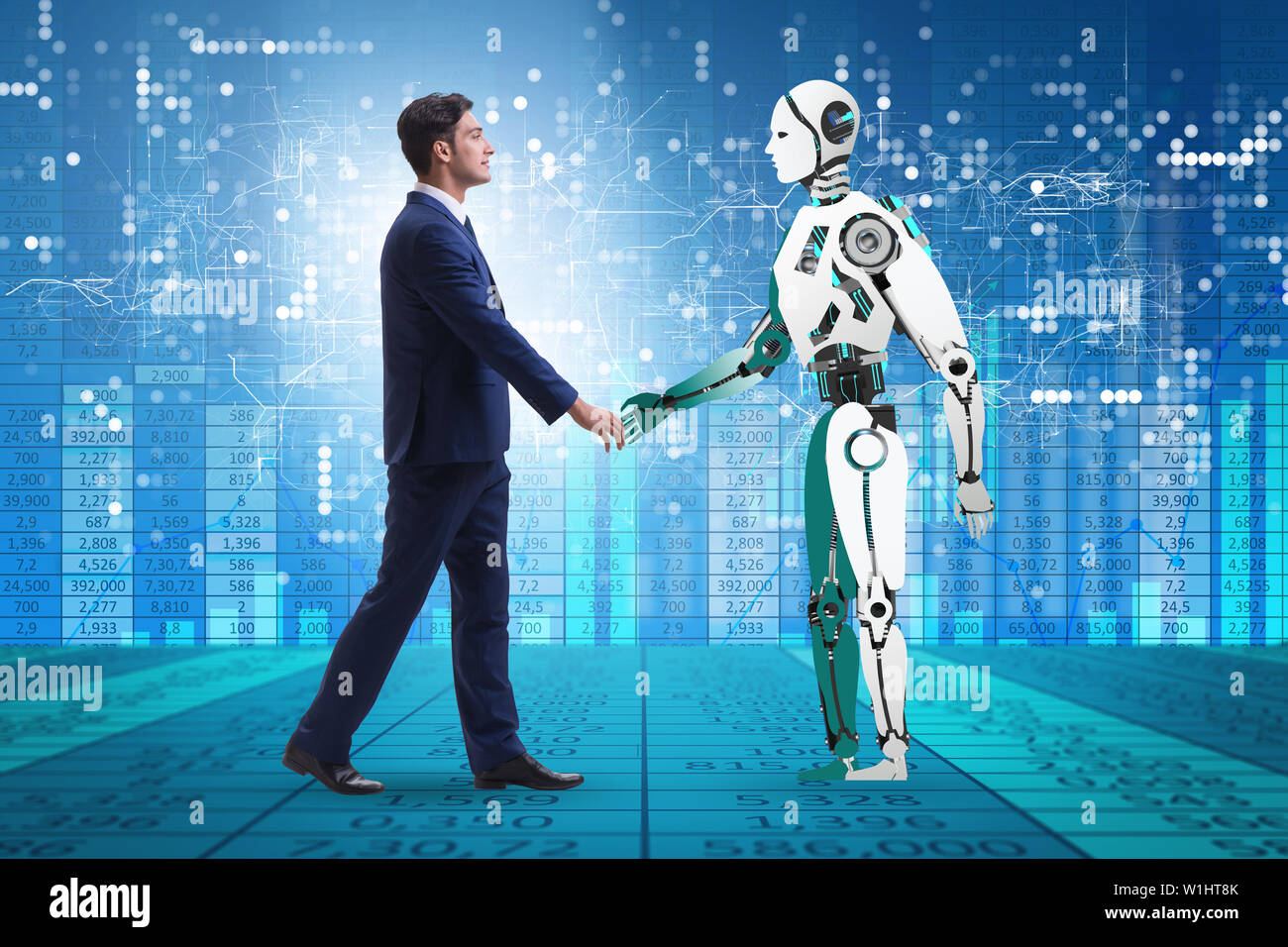 Human Machine Cooperation Digital handshake between man machine hi-res stock photography and ...