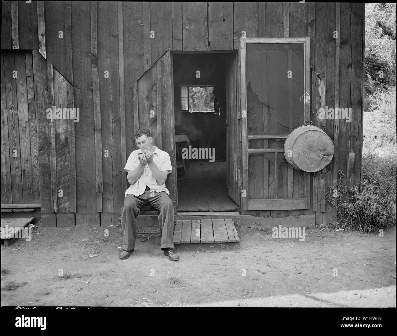 Ray Boggess Miner Sitting In Front Of The Converted Garage In