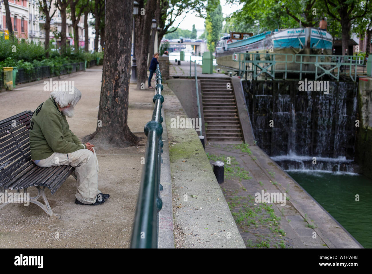 Paris, France - August 4, 2014: a commercial boat navigating the Canal Saint Martin at Paris, France Stock Photo