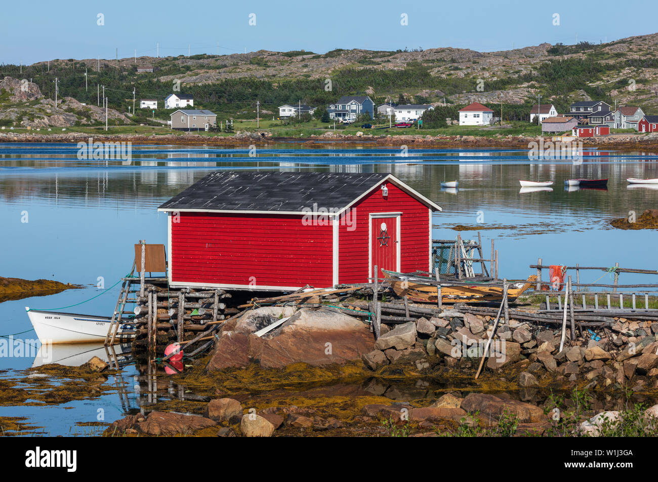 Red fishing stage and town reflection, Joe Batt's Arm, Fogo Island, Newfoundland and Labrador
