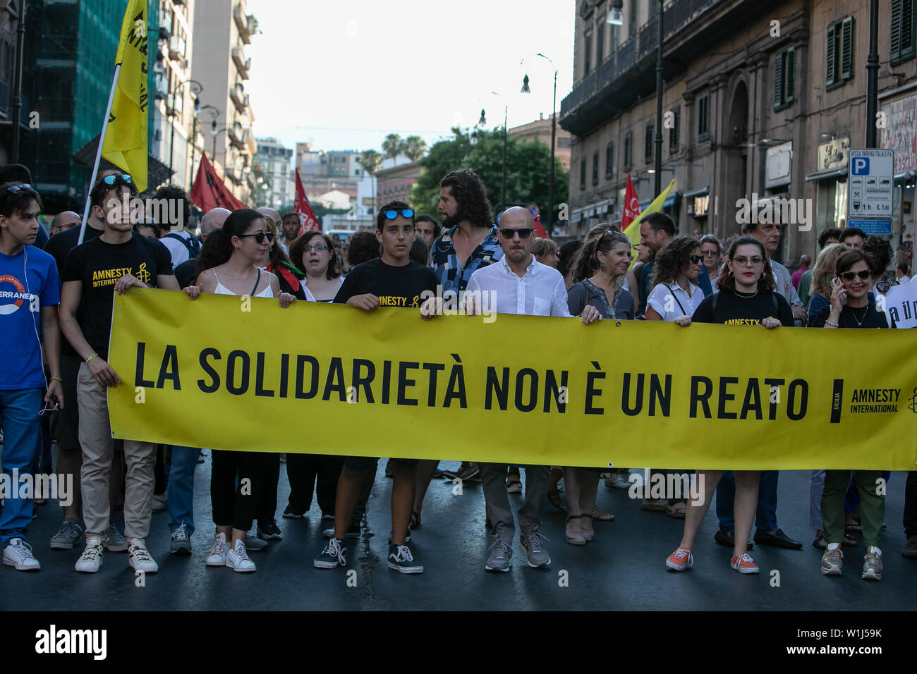 Palermo, Italy. 02nd July, 2019. Amnesty International militants during the demonstration in Palermo to show support for Sea Watch captain Carola Rakete. Credit: Antonio Melita/Pacific Press/Alamy Live News Stock Photo