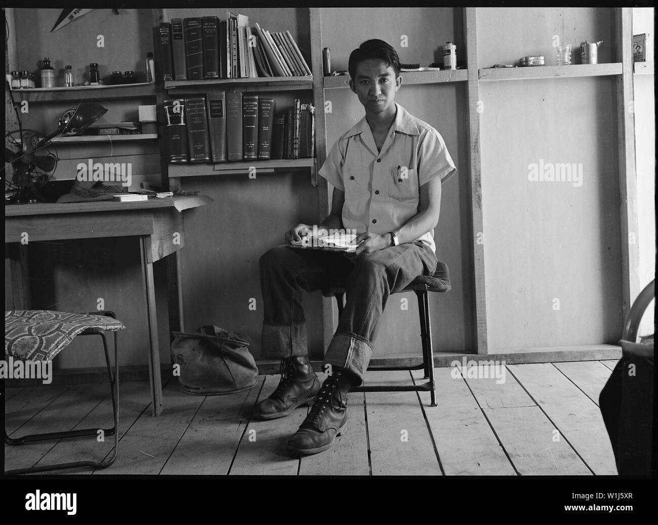 Sacramento, California. Harvey Akio Itano, 21, 1942 graduate from the University of California wher . . .; Scope and content:  The full caption for this photograph reads: Sacramento, California. Harvey Akio Itano, 21, 1942 graduate from the University of California where he received his Bachelor of Science [in] Chemistry degree. He was chosen by the faculty as University Medalist for 1942 and was a member of Phi Beta Kappa and Sigma Xi. Mr. Itano went to the Assembly center prior to the commencement exercises at which President Robert Gordon Sproul said, He cannot be here with us today. His co Stock Photo
