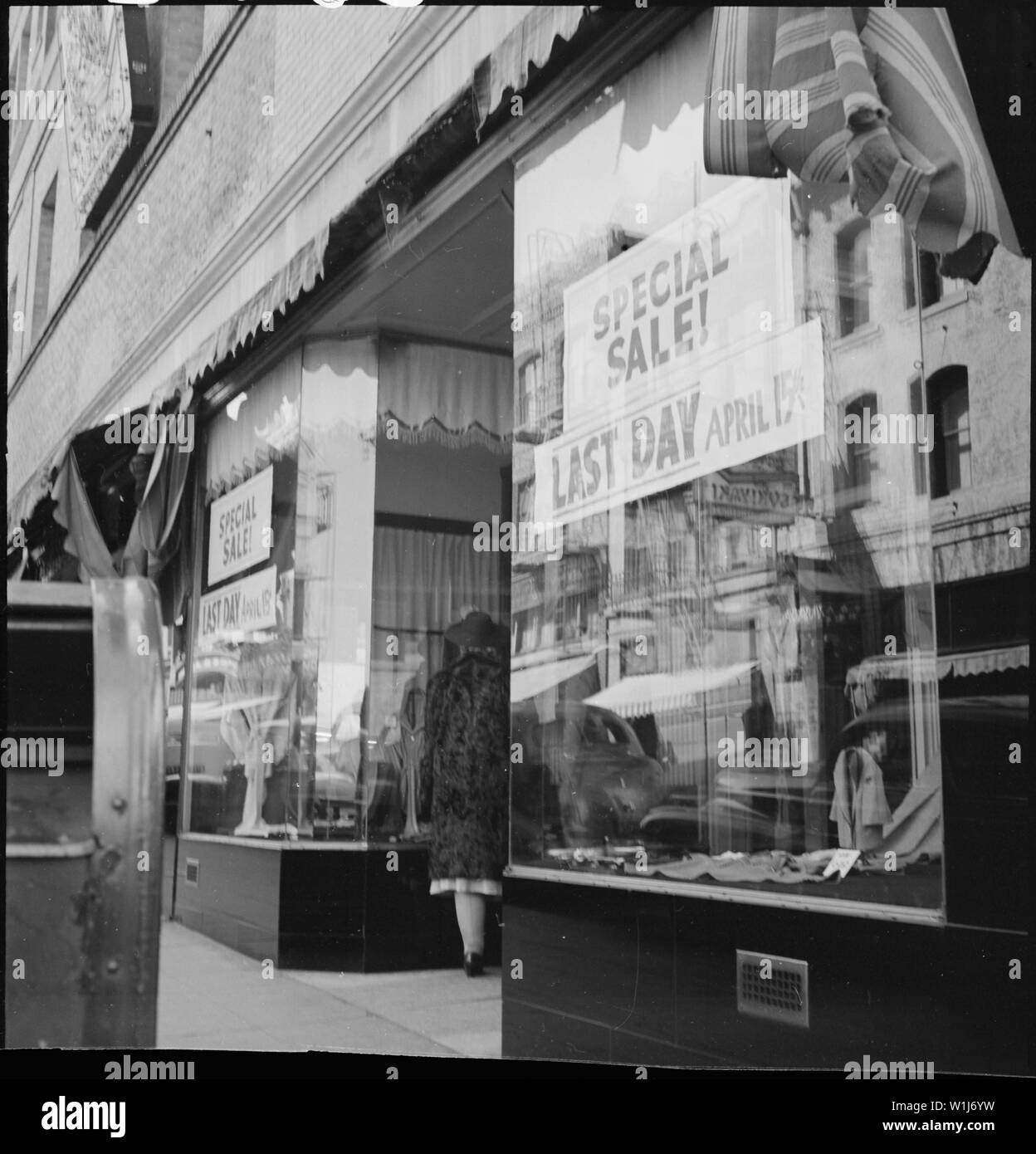 San Francisco, California. A close-out sale- prior to evacuation- at store operated by proprietor o . . .; Scope and content:  The full caption for this photograph reads: San Francisco, California. A close-out sale- prior to evacuation- at store operated by proprietor of Japanese ancestry on Grant Avenue in Chinatown. The evacuees of Japanese descent will be housed in War Relocation Authority centers for the duration. Stock Photo