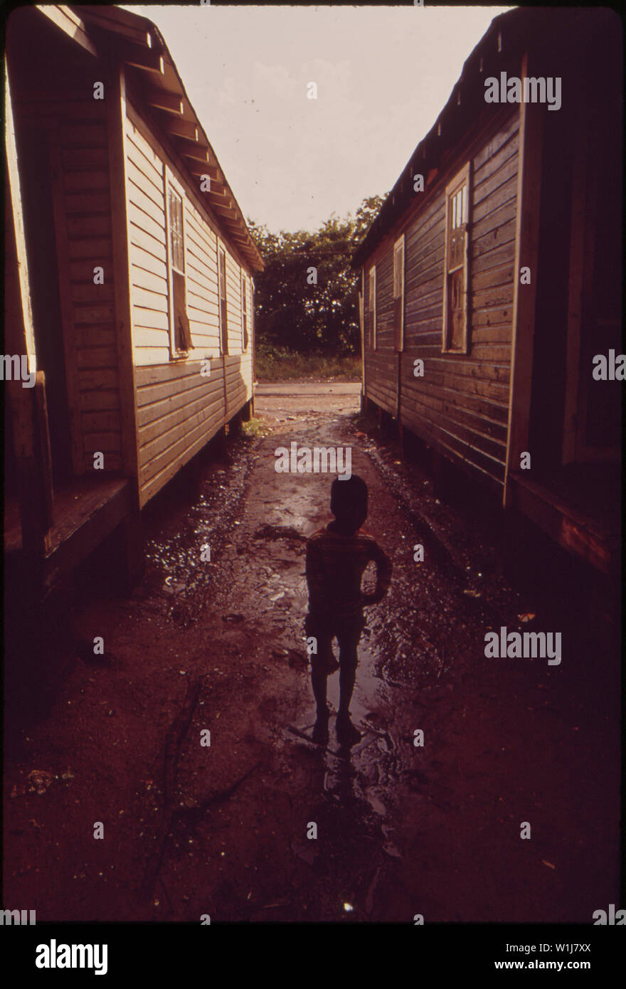 Scene in Little Korea, in South Birmingham. Despite the significant progress of recent years, many Birmingham blacks still live in areas of substandard housing of which this is a prime example. Several creeks flow through the community. During heavy rains, these are apt to overflow, and residents must often be evacuated. Birmingham, Alabama. July, 1972 Stock Photo