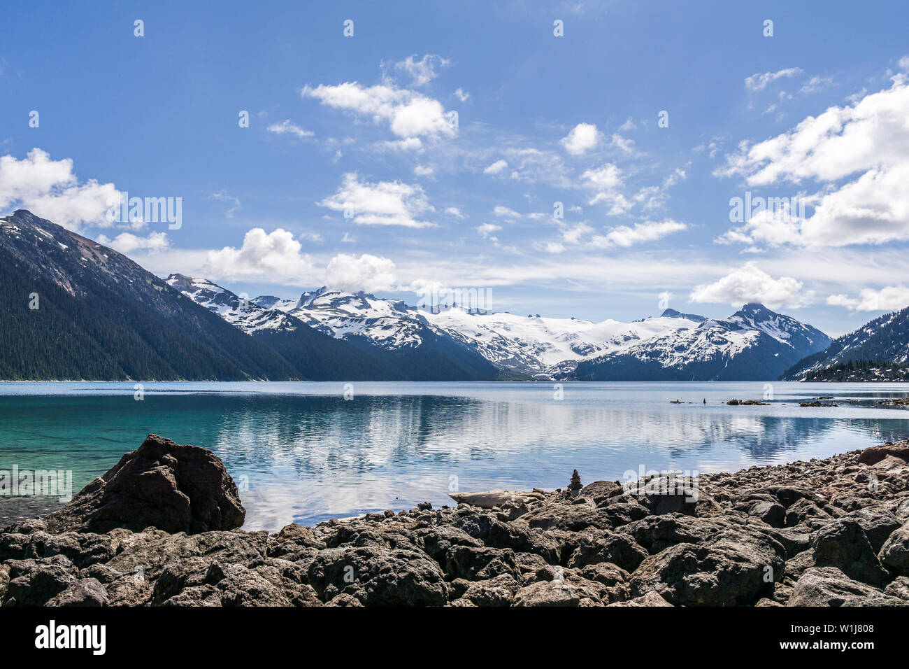 view at Garibaldi lake beautiful sunny morning with clouds on bluew sky. Stock Photo