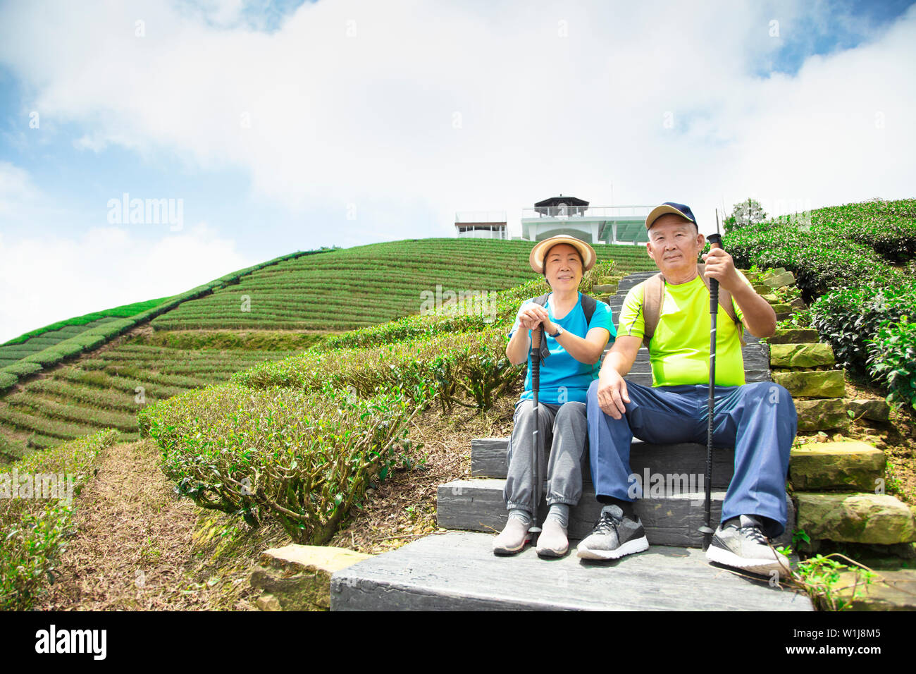happy asian senior couple hiking in the nature Stock Photo - Alamy