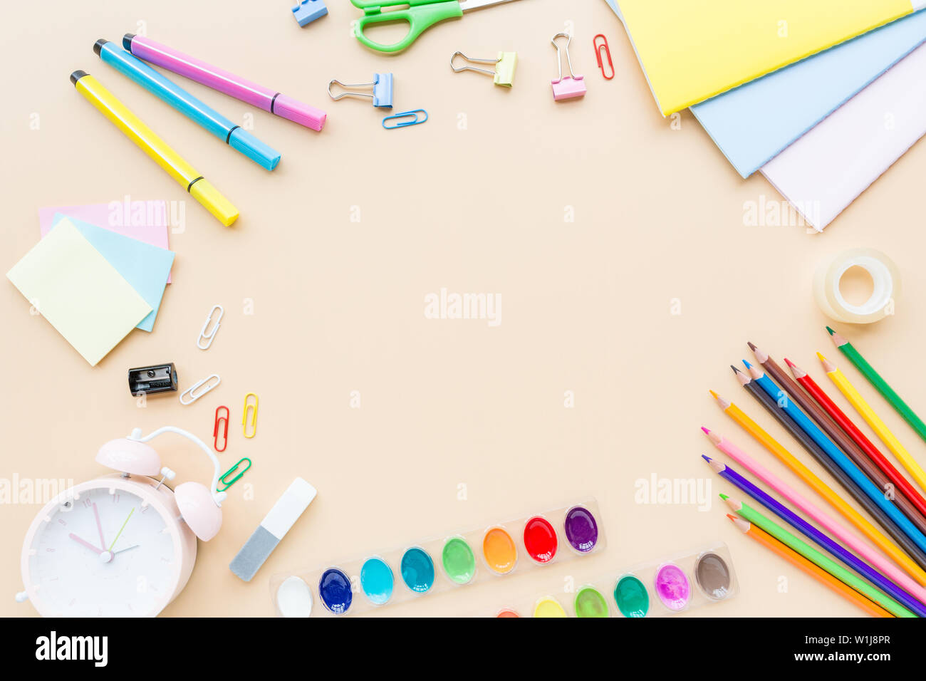 Orange back to school flat lay with bright stationery. School supplies ...