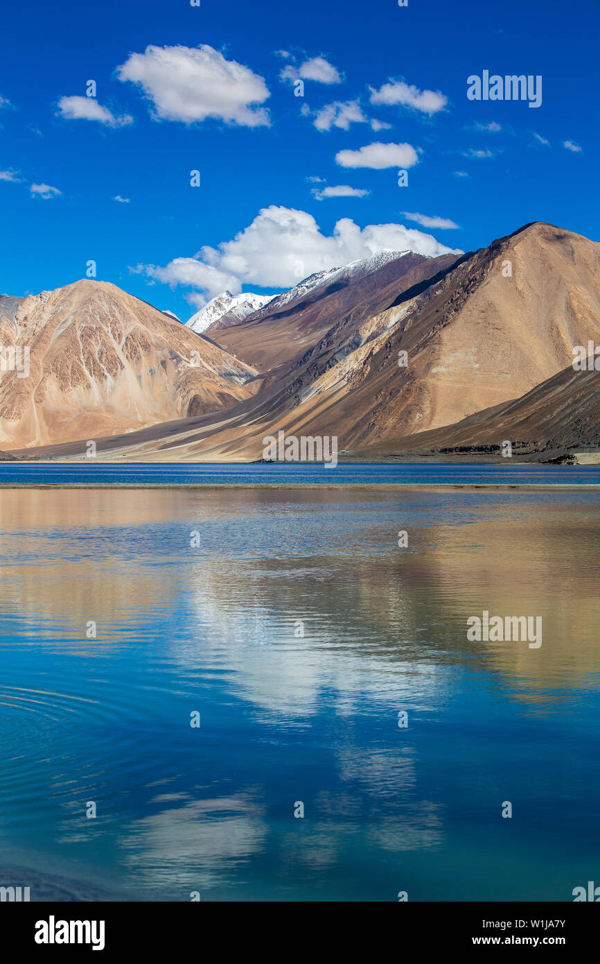 View of majestic rocky mountains against the blue sky and lake Pangong in Indian Himalayas, Ladakh region, Jammu and Kashmir, India. Nature and travel Stock Photo
