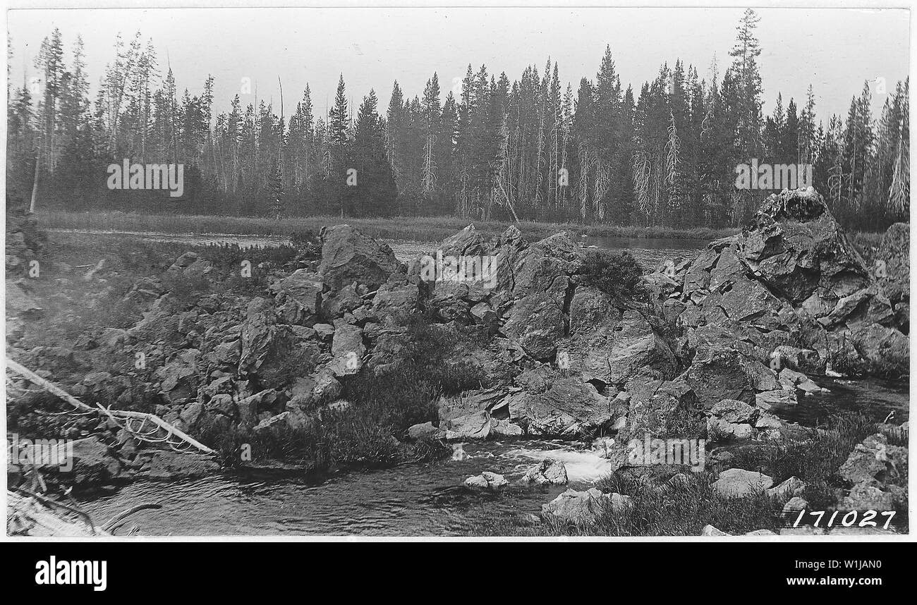 Elk Lake Alootment, Main Outlet of Mud Lake, Deschutes Forest, Oregon, 1922.; General notes:  Water runs out through crevices in lava rock and immediately sinks into a narrow cleft in the rock. Stock Photo