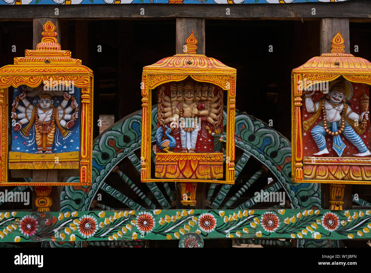 24-jun-2007 Gods statues at wheel of chariot rath yatra of jagannath ; Puri ; Orissa ; India Stock Photo