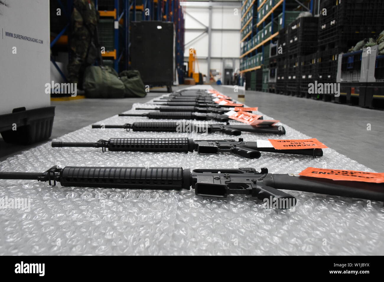 M16 rifles waiting to be inspected and shipped out June 6, 2019 at Ramstein Air Base, Germany. The rifles were packaged for shipping by Airmen from the 86th Logistics Readiness Squadron, and the Tennessee Air National Guard’s 118th LRS. (U.S. Air National Guard photo by Tech. Sgt. Mark Thompson) Stock Photo