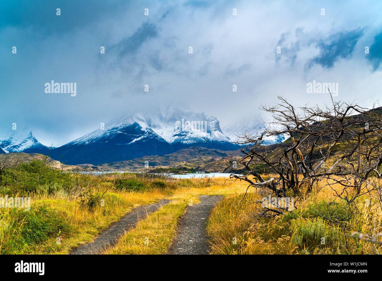 View of Cuernos Del Paine mountain with fog and rain clouds at Lake Pehoe in Torres del Paine National Park, Chile Stock Photo