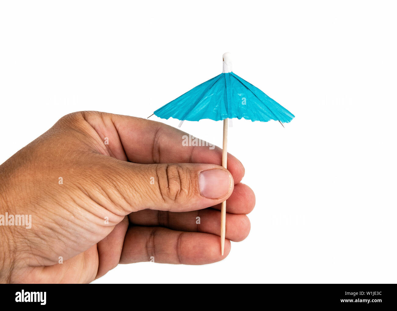 Hand holding cocktail umbrella hi-res stock photography and images - Alamy