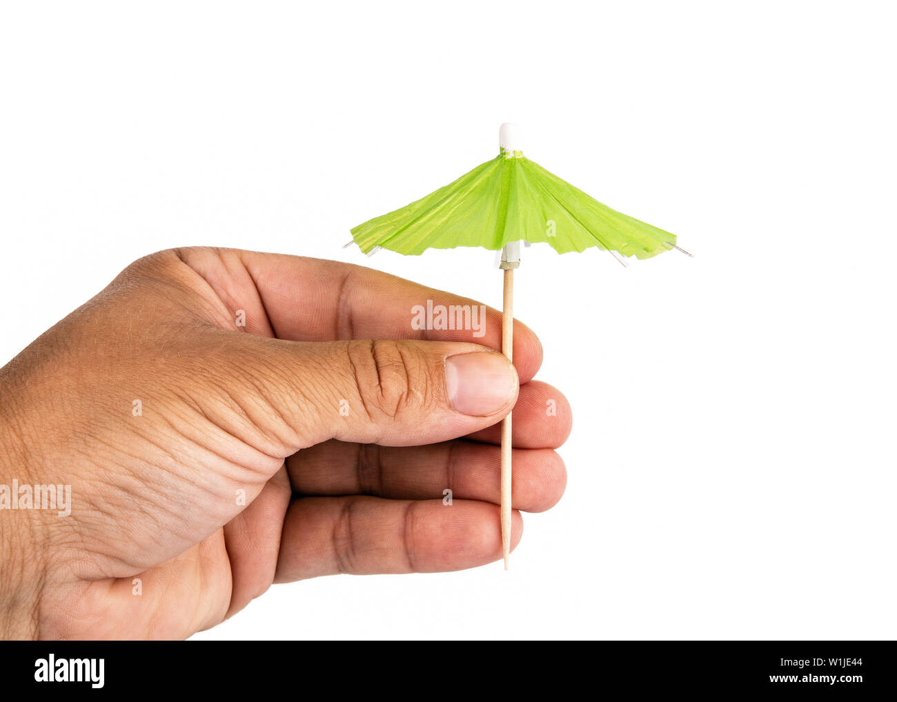 Hand holding cocktail umbrella hi-res stock photography and images - Alamy