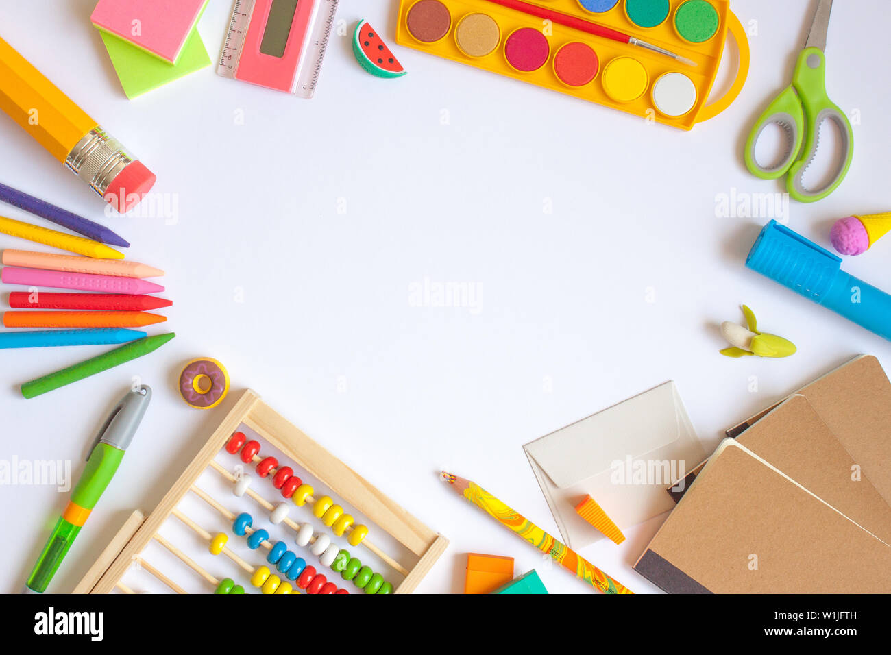 Colorful school supplies on white background. Back to school concept ...