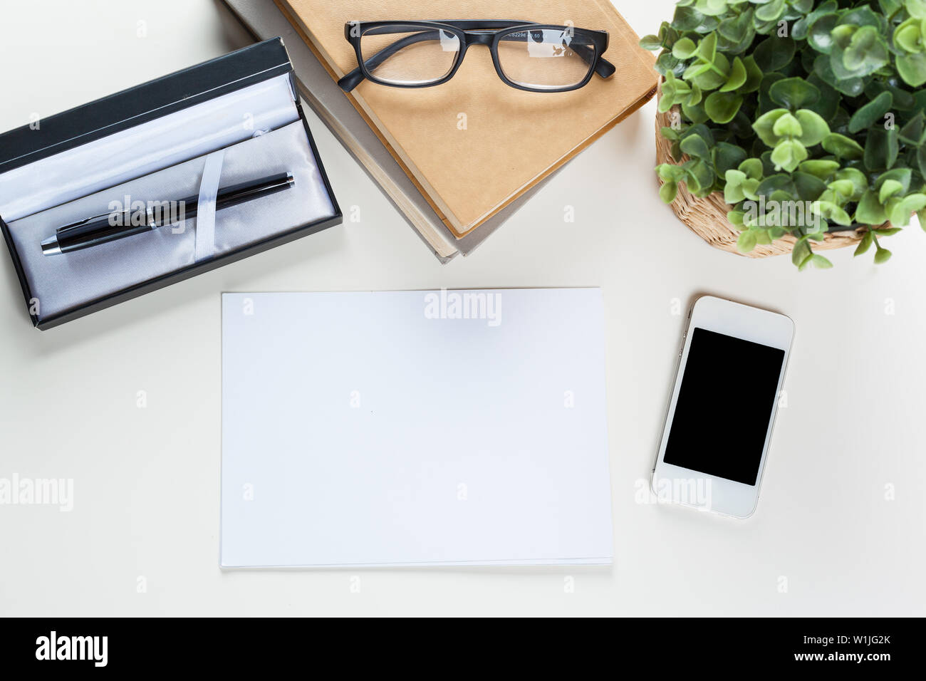 White office desk table with a lot of things on it. Top view Stock ...