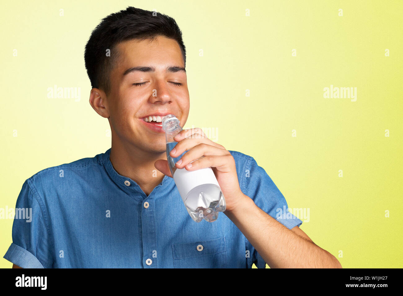 Young man with a water bottle Stock Photo - Alamy