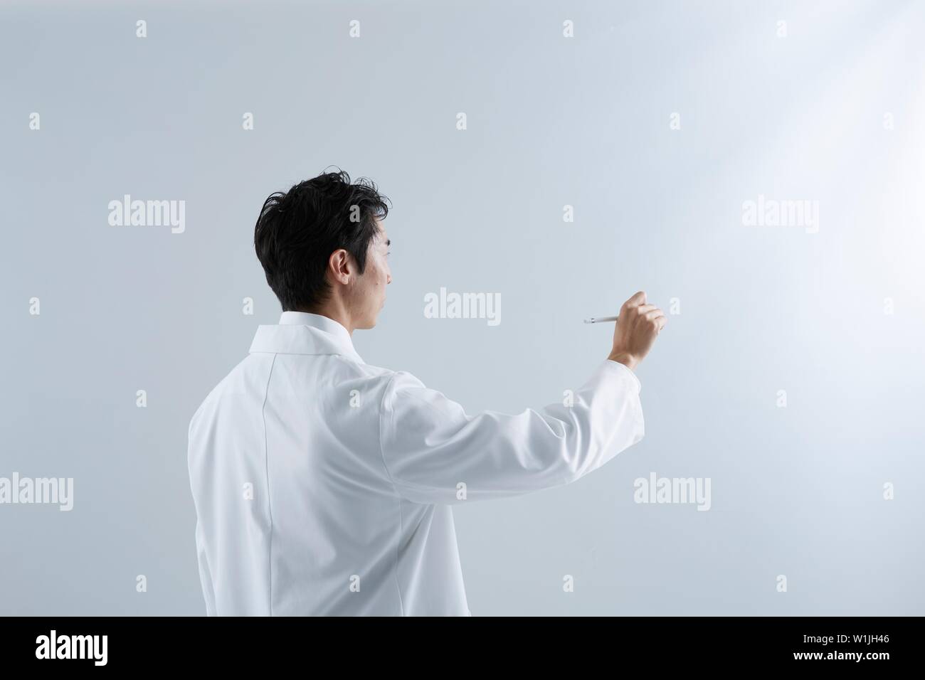 Rear view shot male doctor hi-res stock photography and images - Alamy