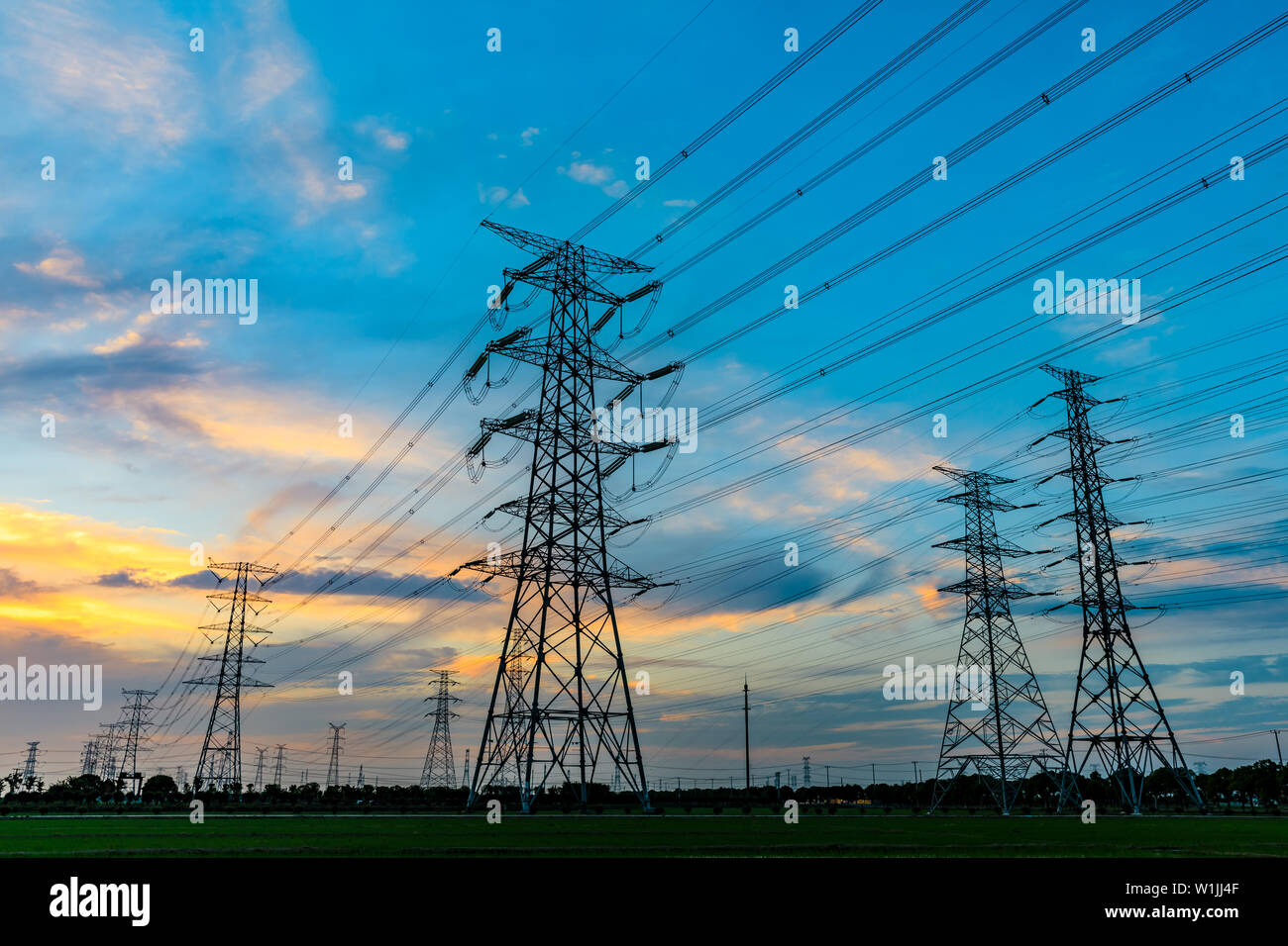 High voltage post,High voltage tower sky sunset background Stock Photo ...