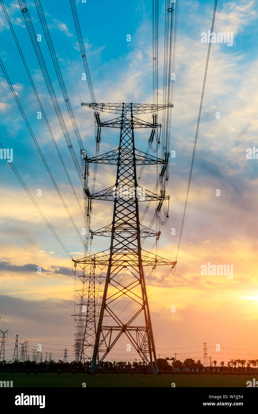 High voltage post,High voltage tower sky sunset background Stock Photo ...