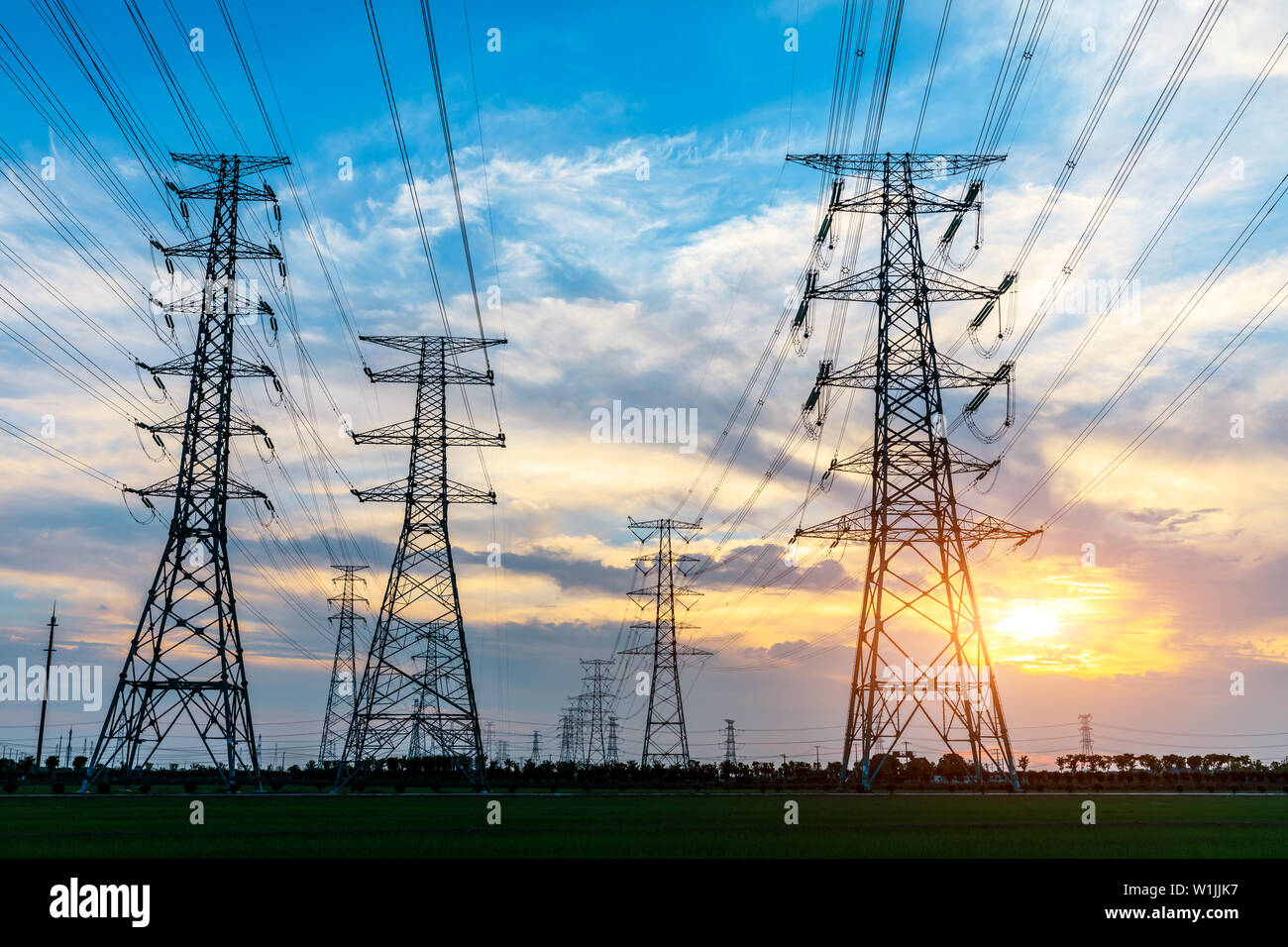 High voltage post,High voltage tower sky sunset background Stock Photo ...
