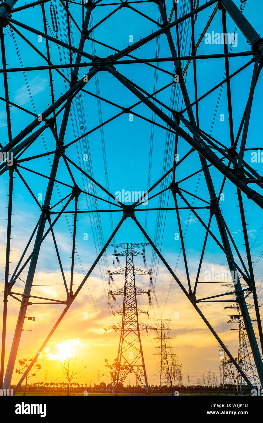 High voltage post,High voltage tower sky sunset background Stock Photo ...