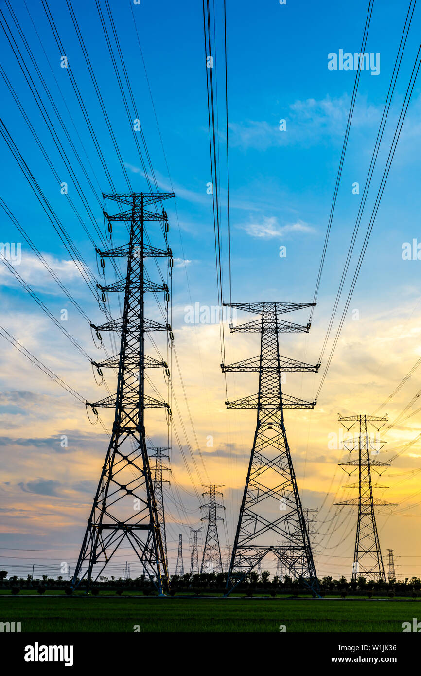 High voltage post,High voltage tower sky sunset background Stock Photo ...
