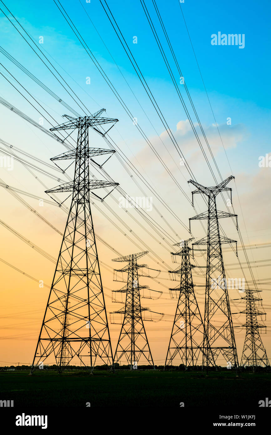 High voltage post,High voltage tower sky sunset background Stock Photo ...