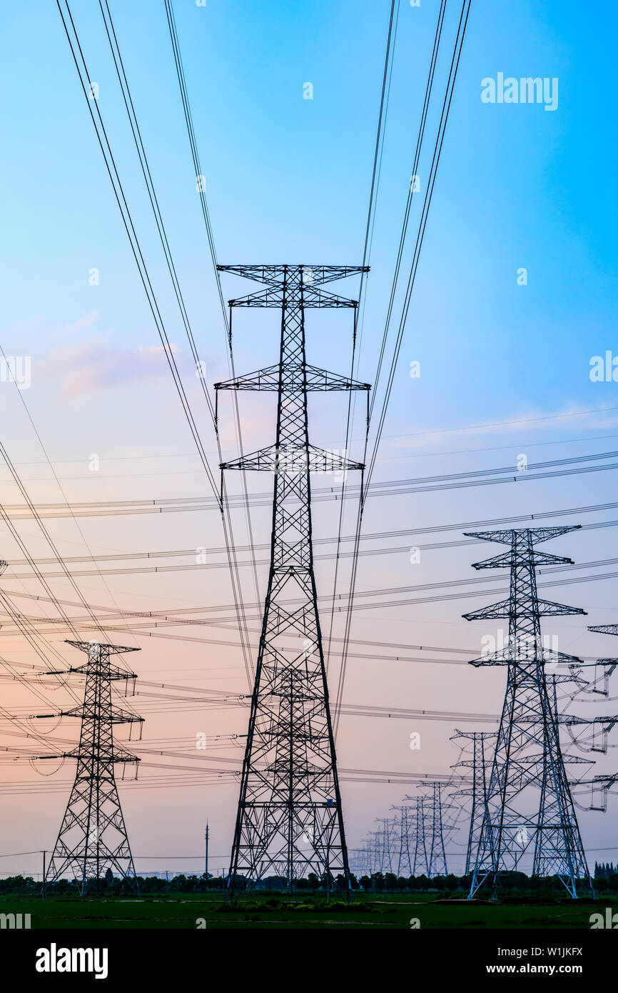 High voltage post,High voltage tower sky sunset background Stock Photo ...