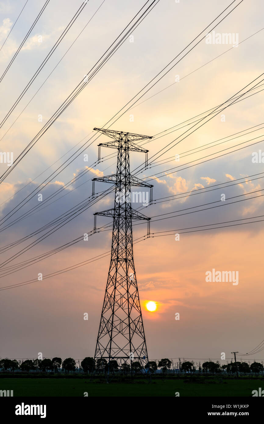 High voltage post,High voltage tower sky sunset background Stock Photo ...