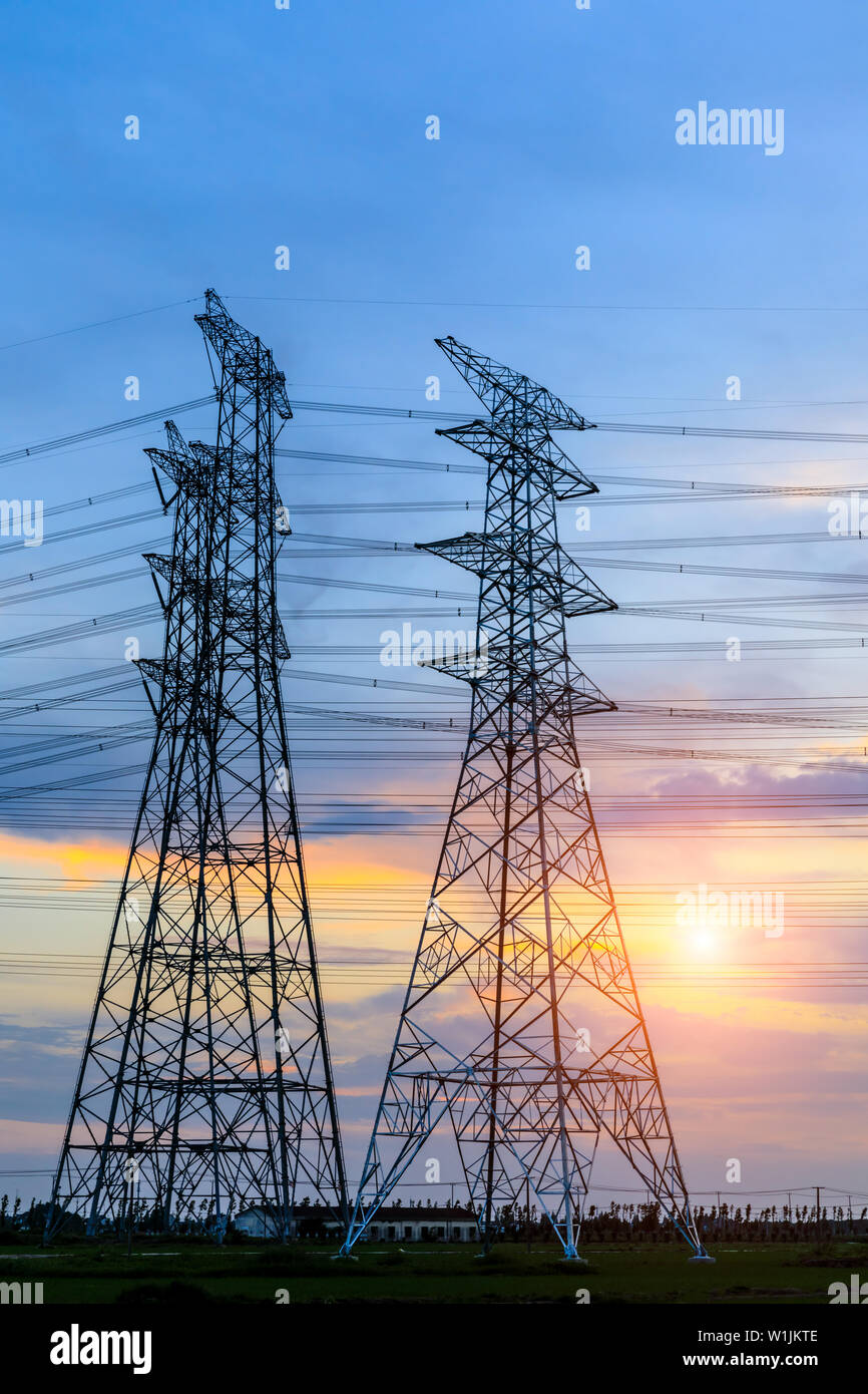 High voltage post,High voltage tower sky sunset background Stock Photo ...