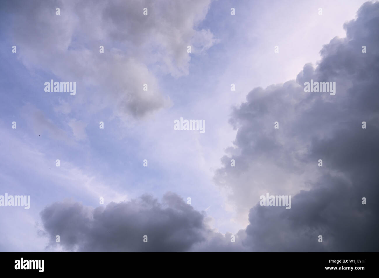 Rain clouds moving through the purity purple sky Stock Photo