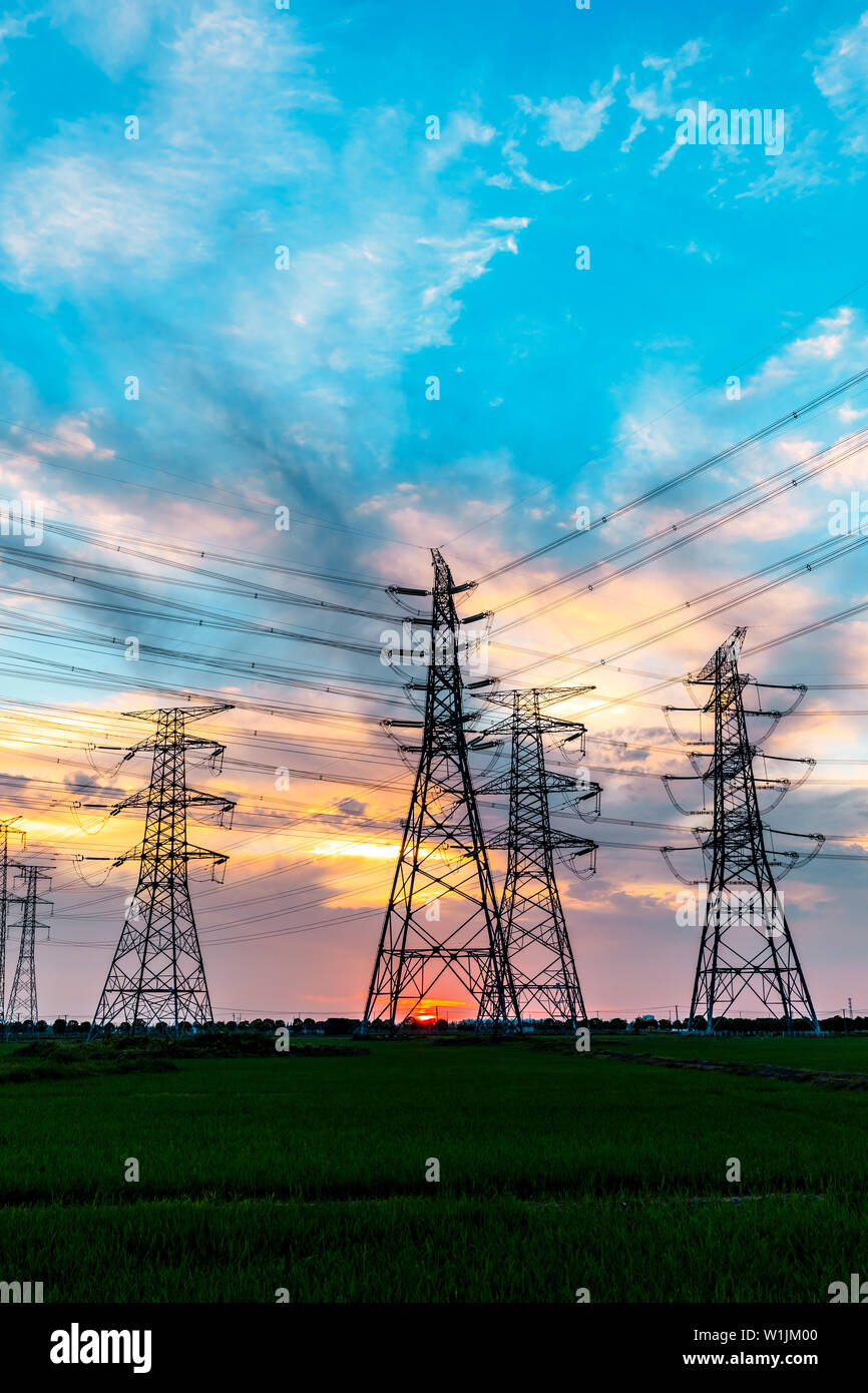 High voltage post,High voltage tower sky sunset background Stock Photo ...