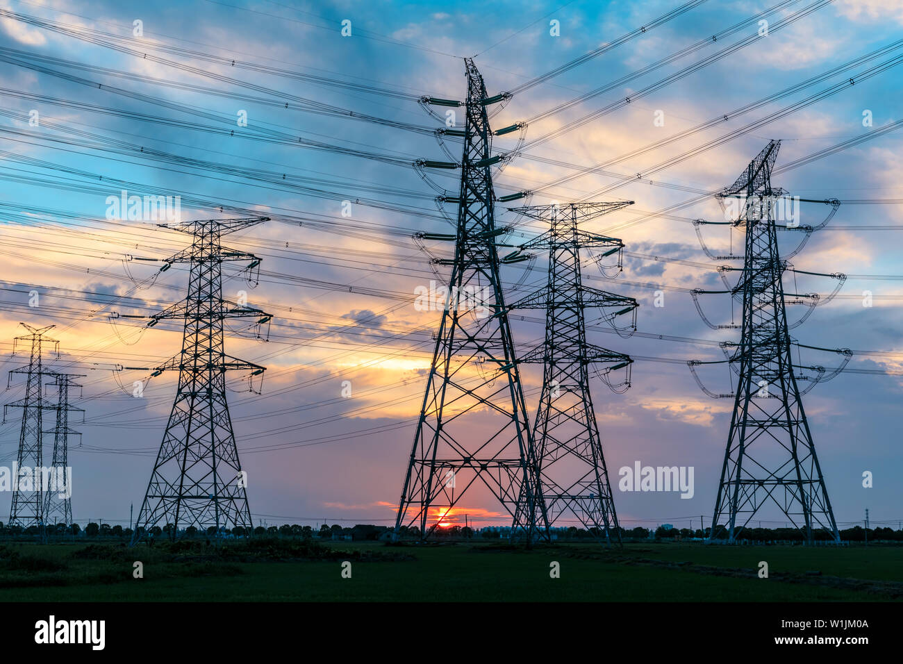High voltage post,High voltage tower sky sunset background Stock Photo ...