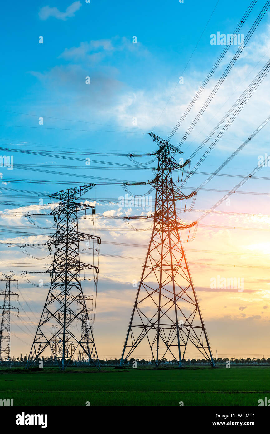 High voltage post,High voltage tower sky sunset background Stock Photo ...