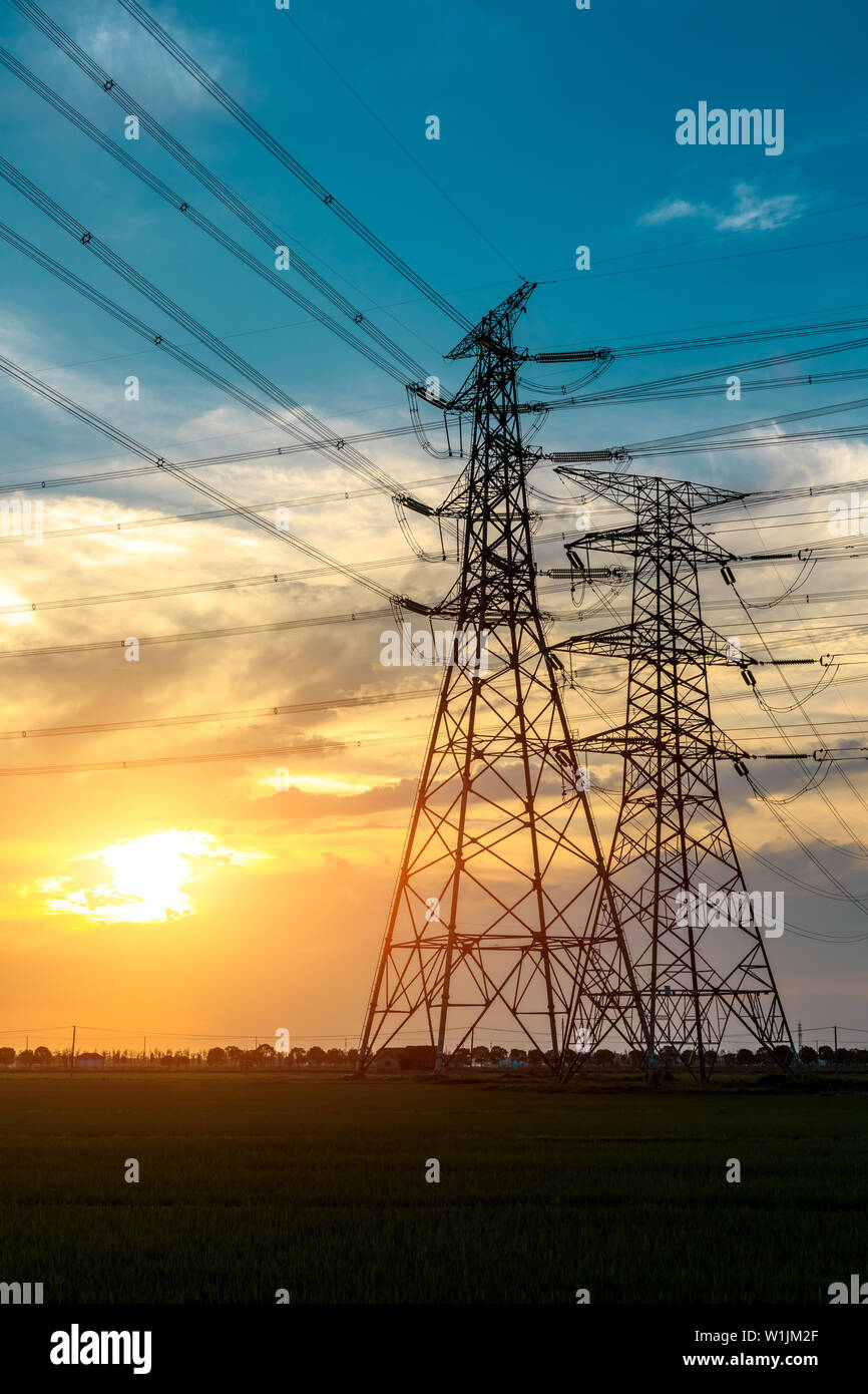 High voltage post,High voltage tower sky sunset background Stock Photo ...