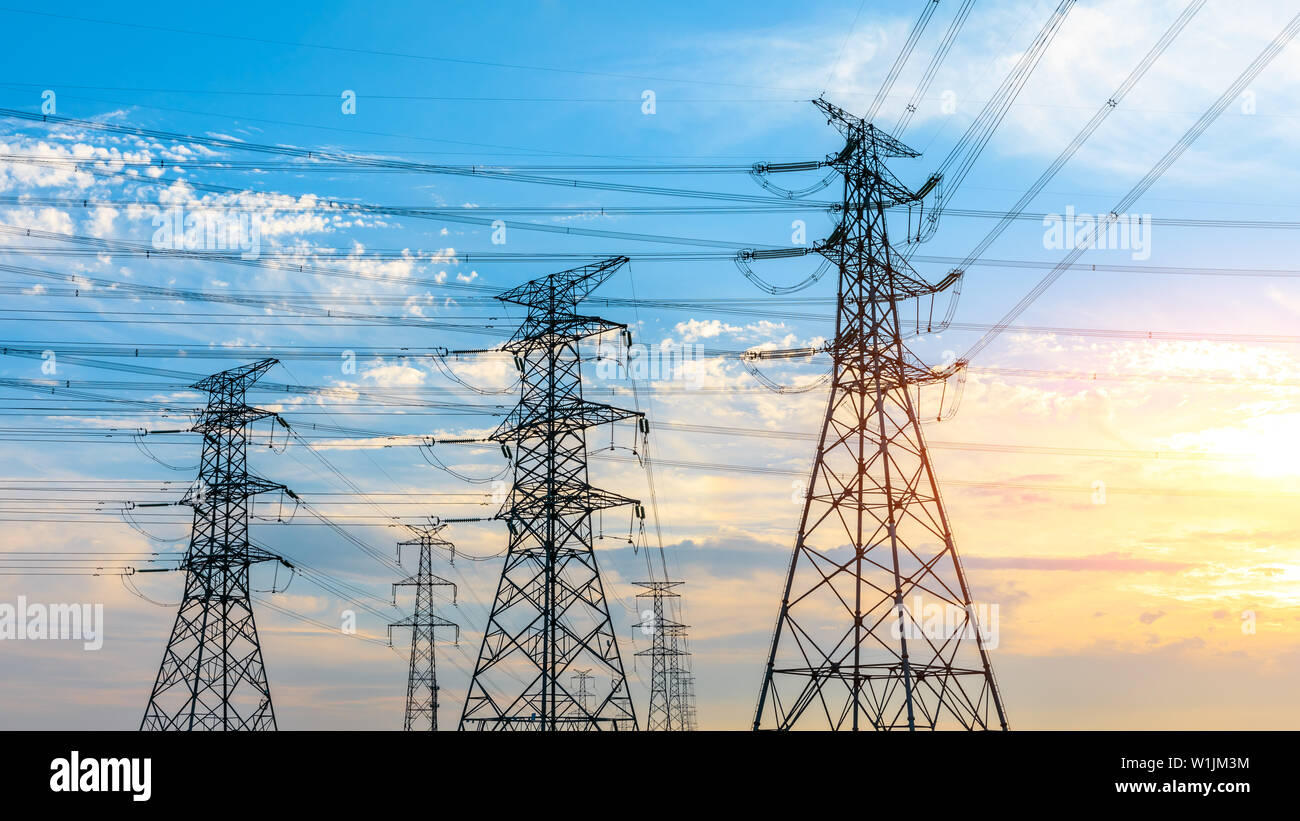 High voltage post,High voltage tower sky sunset background Stock Photo ...