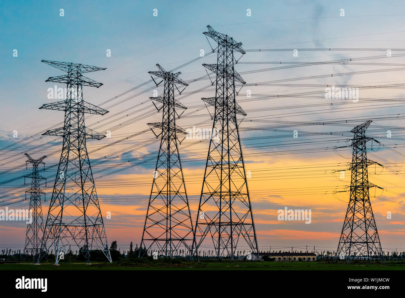 High voltage post,High voltage tower sky sunset background Stock Photo ...