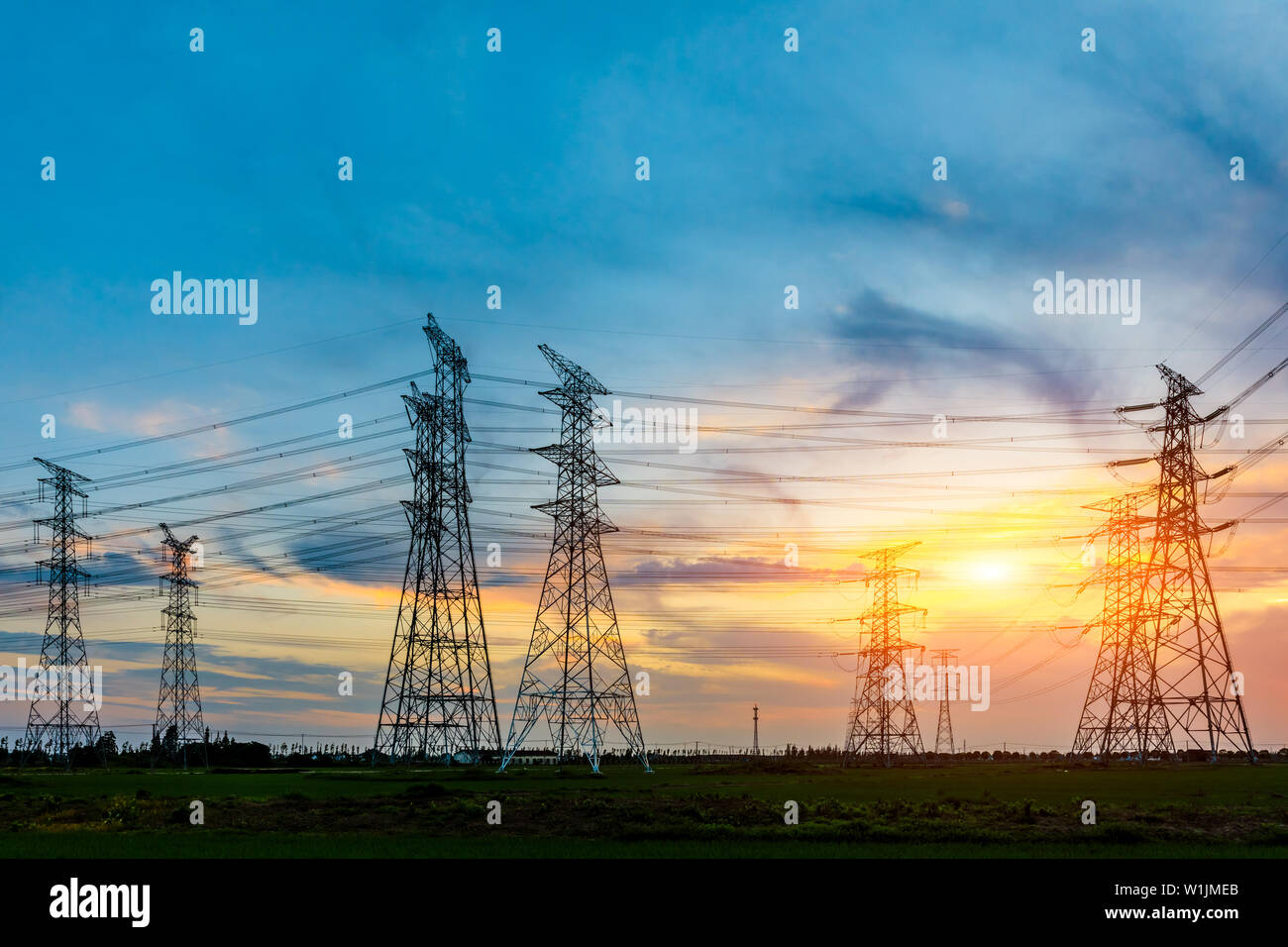 High voltage post,High voltage tower sky sunset background Stock Photo ...