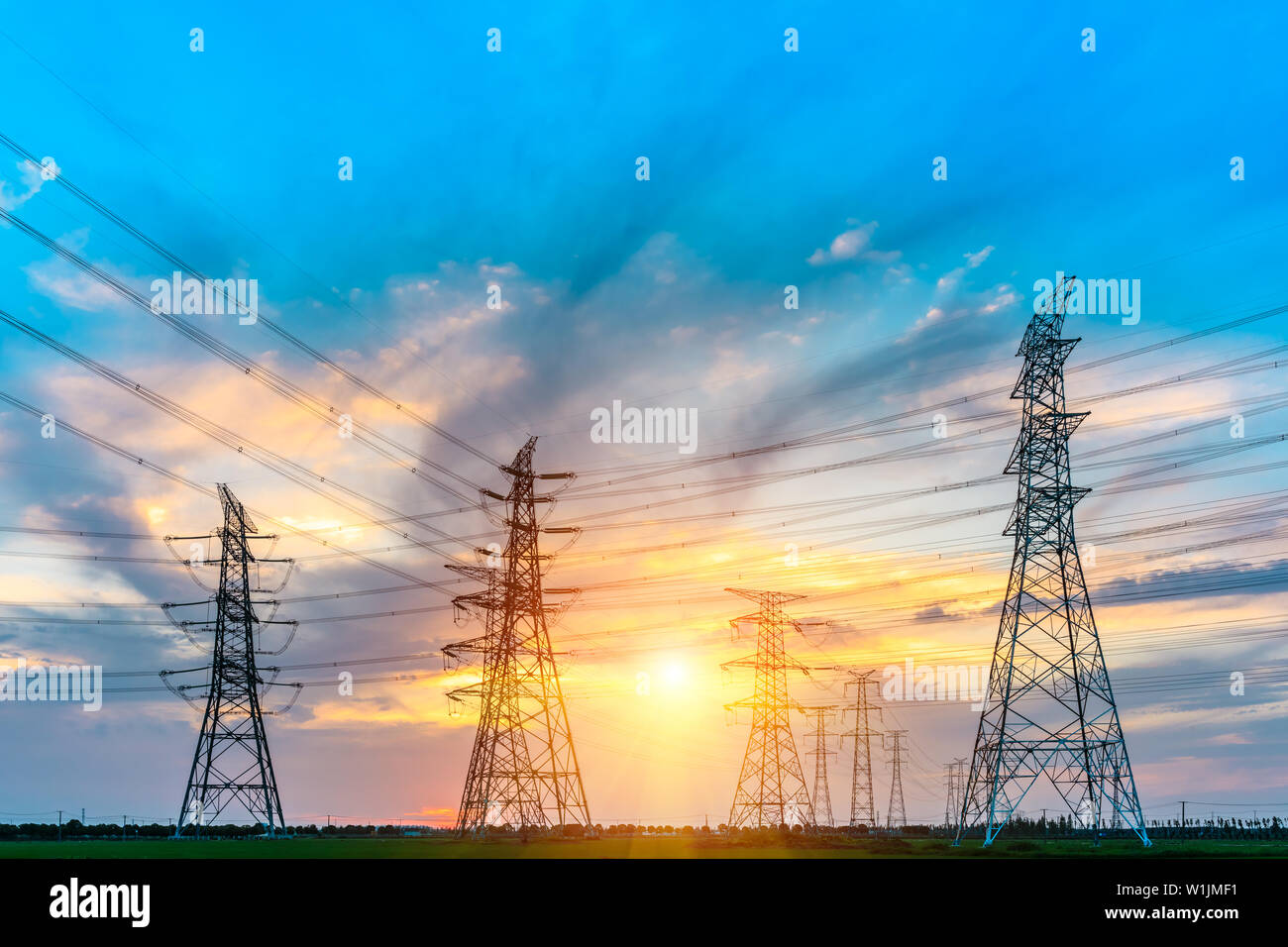 High voltage post,High voltage tower sky sunset background Stock Photo ...