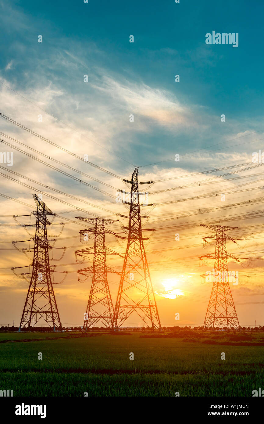 High voltage post,High voltage tower sky sunset background Stock Photo ...