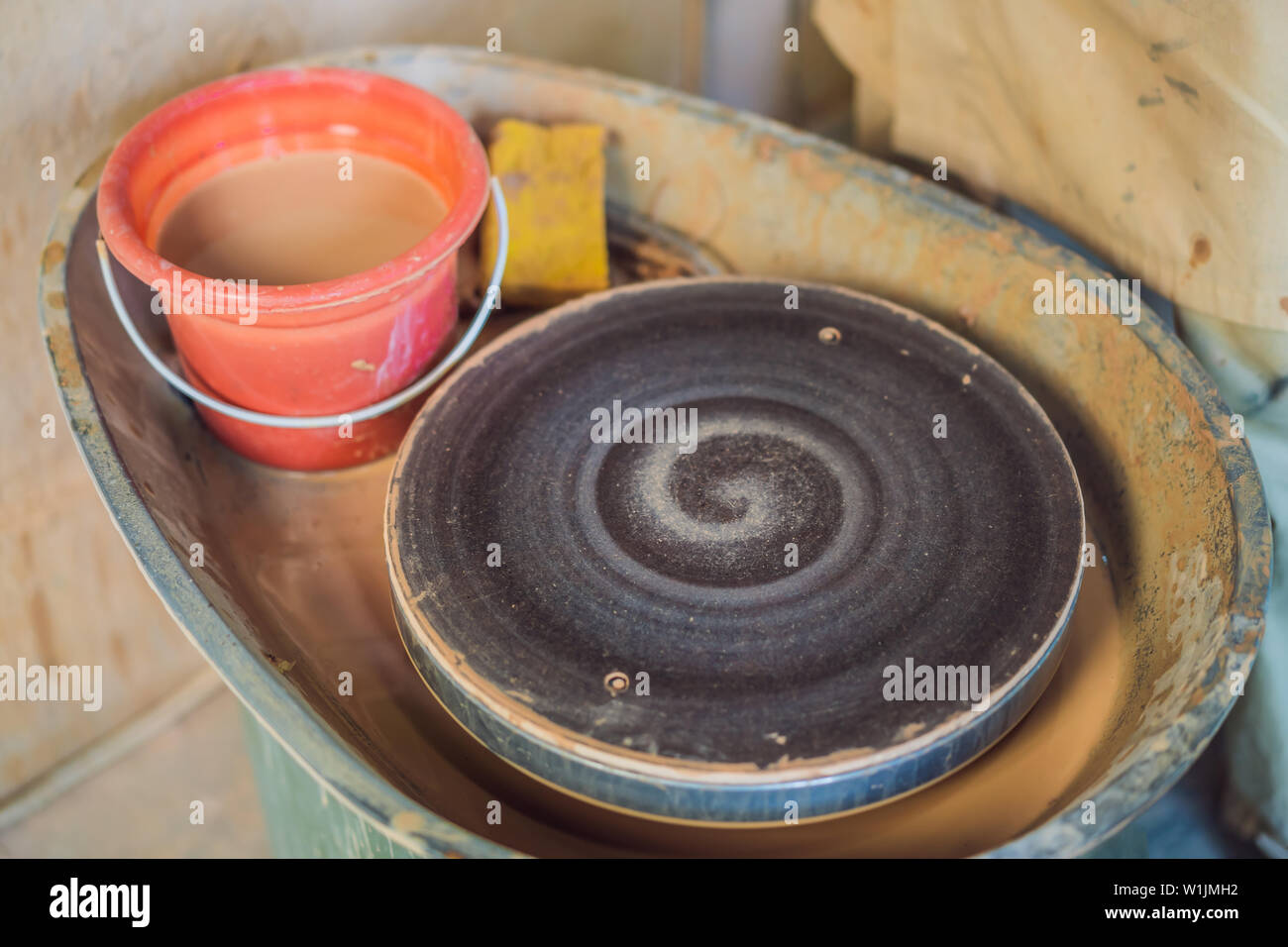 Rotating disc for pottery in a pottery workshop Stock Photo