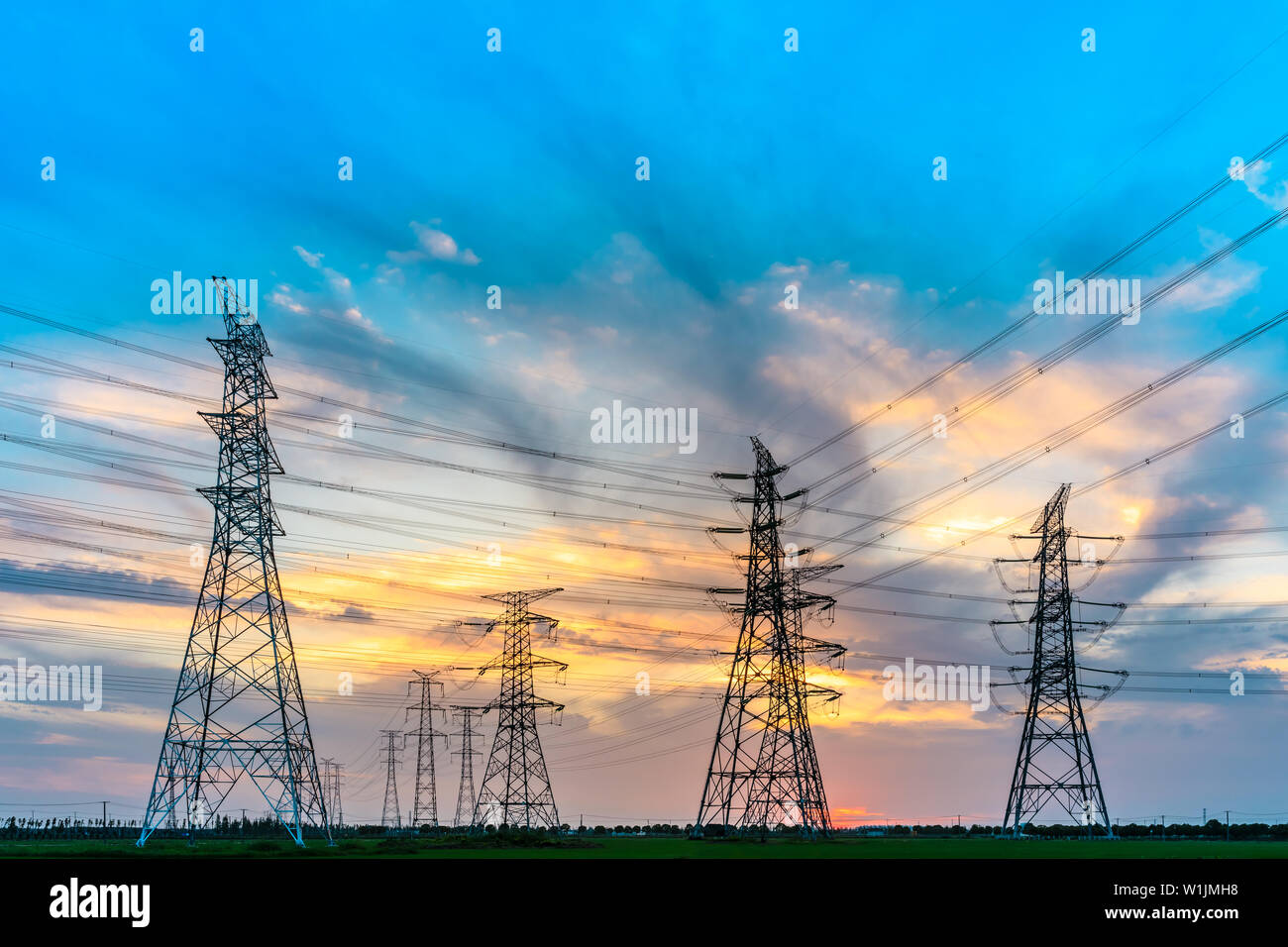 High voltage post,High voltage tower sky sunset background Stock Photo ...
