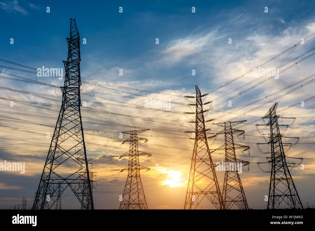 High voltage post,High voltage tower sky sunset background Stock Photo ...