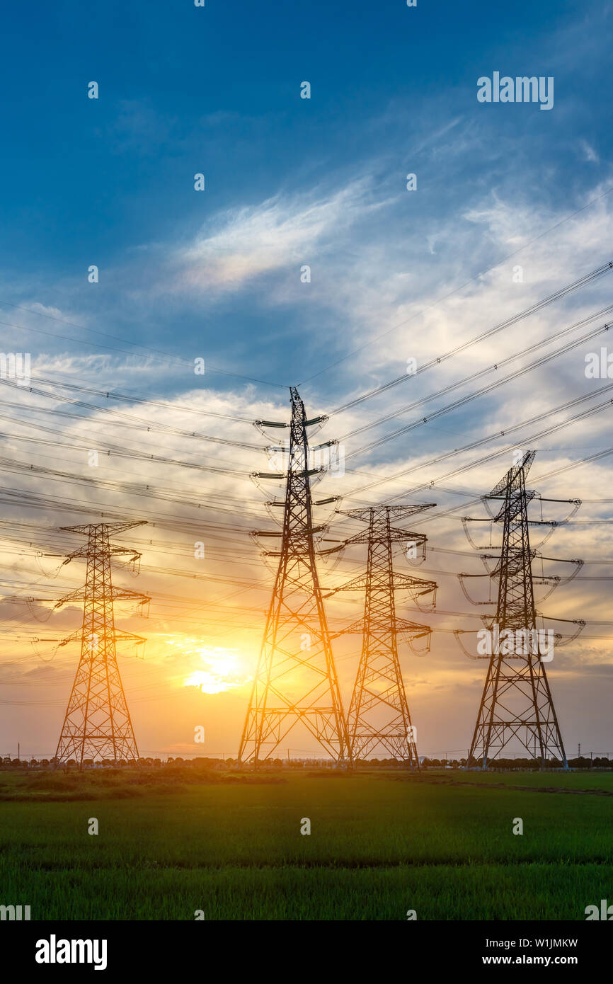 High voltage post,High voltage tower sky sunset background Stock Photo ...