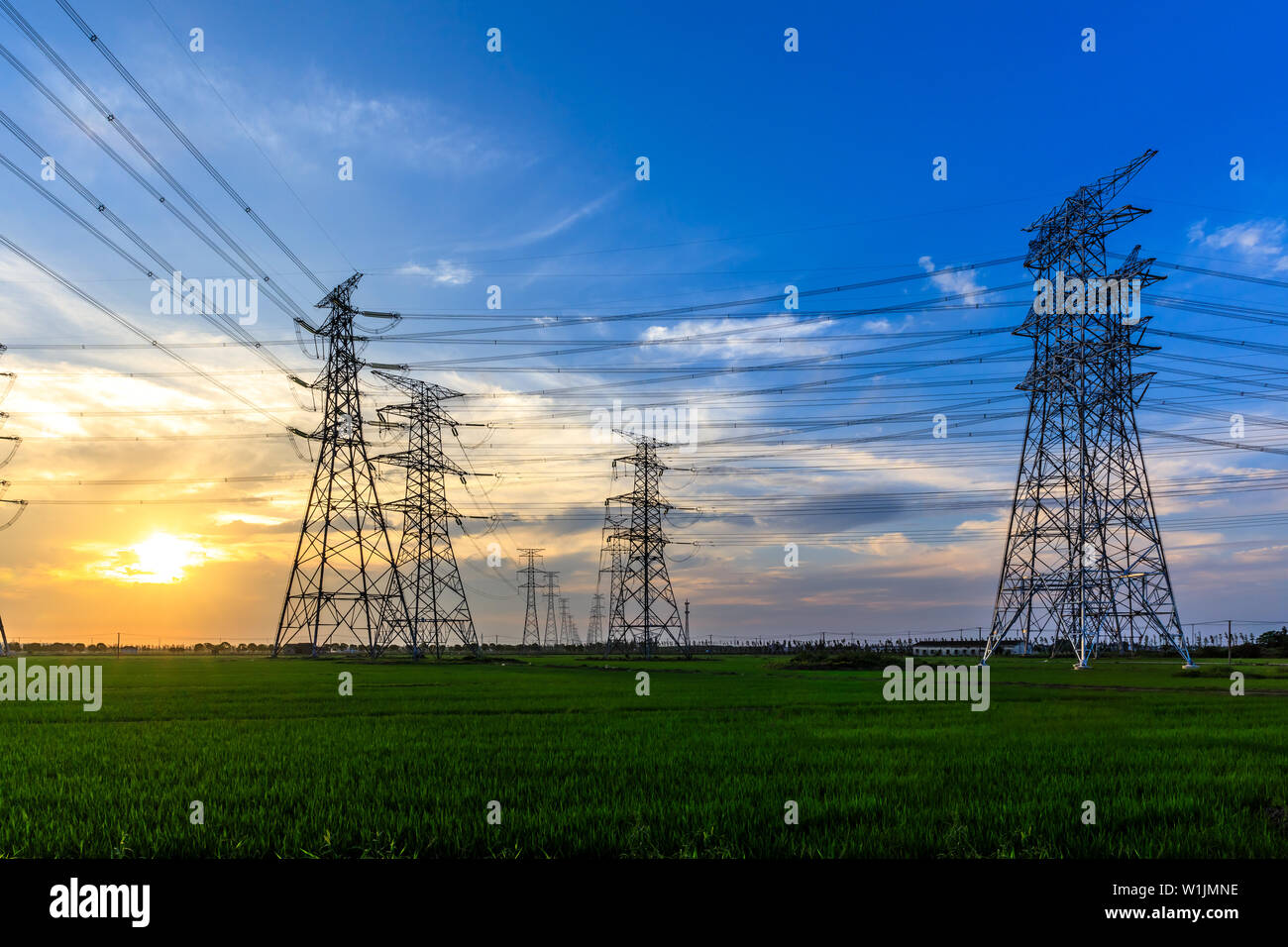 High voltage post,High voltage tower sky sunset background Stock Photo ...