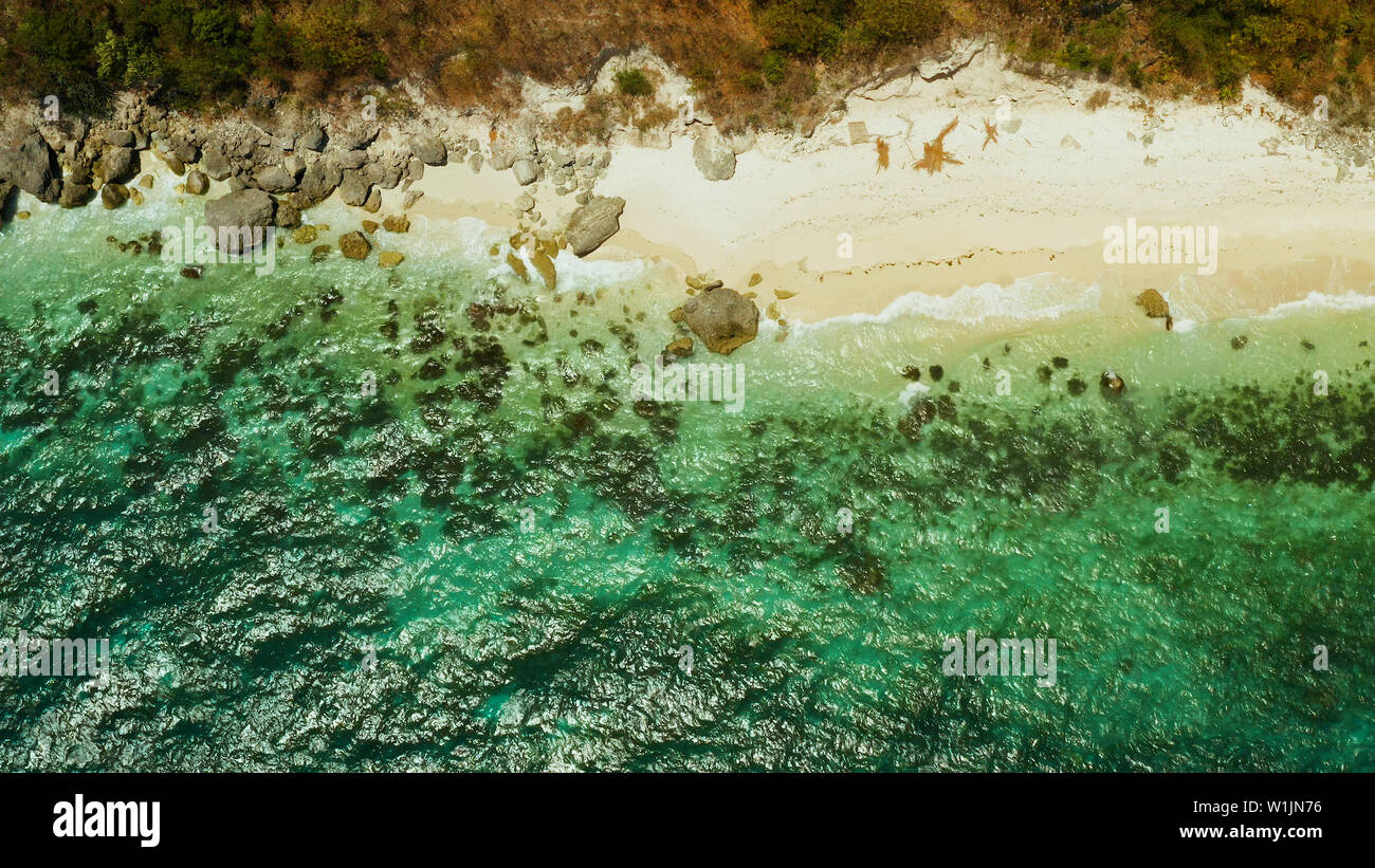 Tropical sandy beach with wave and turquoise water,copy space for text, aerial view. Ocean with waves and tropical beach. Summer and travel vacation concept Stock Photo