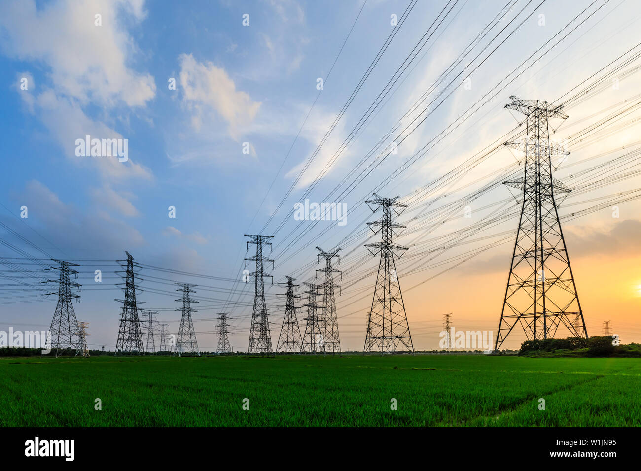 High voltage post,High voltage tower sky sunset background Stock Photo ...